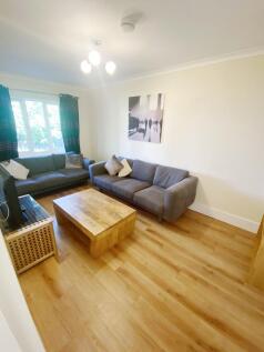 Bright, modern living room with two comfortable...