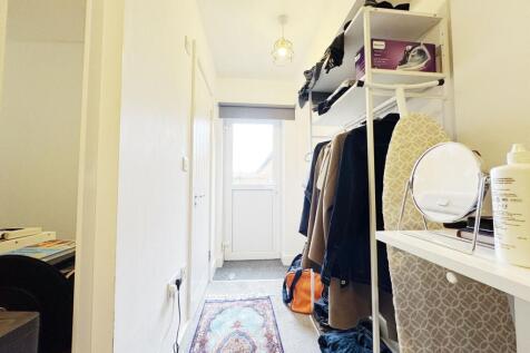 Bright, tidy entrance hall with a coated floor ...