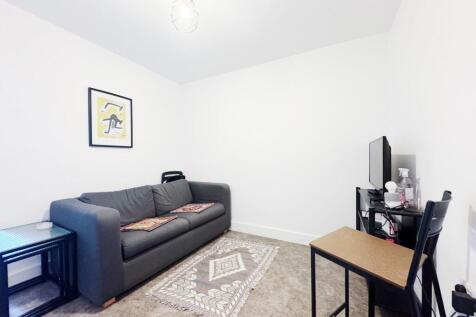 Bright, minimal living room with a comfortable ...