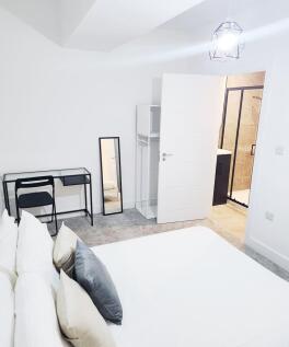 Bright, modern bedroom with a comfortable doubl...