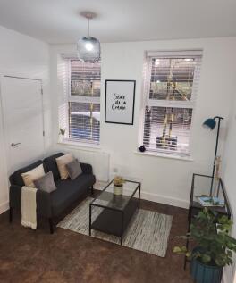 A bright and inviting living room featuring a m...