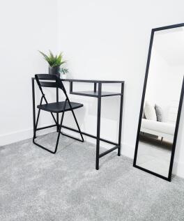 Bright, minimalist bedroom corner with a sleek ...