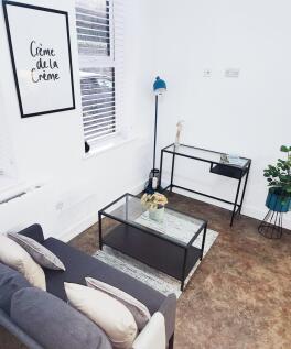 Bright, contemporary living area with a comfort...