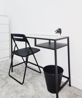 Bright minimalist study nook with a sleek black...