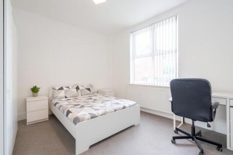 Bright and well-maintained bedroom featuring a ...