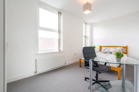 Bright and airy bedroom featuring a double bed,...