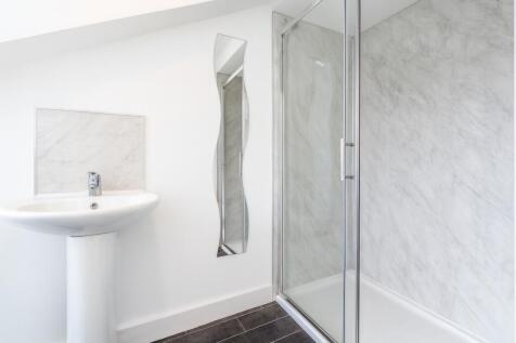 Modern bathroom featuring a sleek sink with a m...