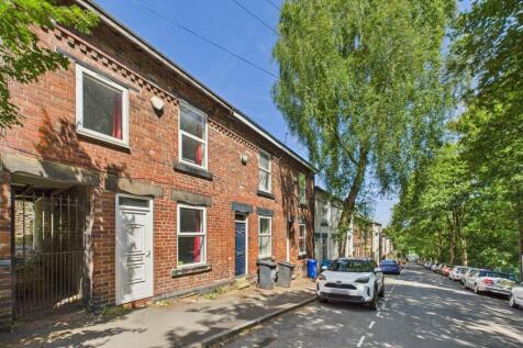 A charming exterior view of a traditional brick...