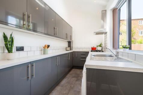 Modern and well-maintained kitchen with sleek g...