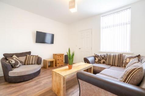 Bright and welcoming living room featuring comf...