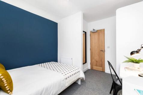 A clean and well-lit small restroom with a simp...