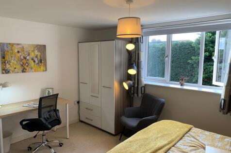 A bright and inviting double bedroom featuring ...