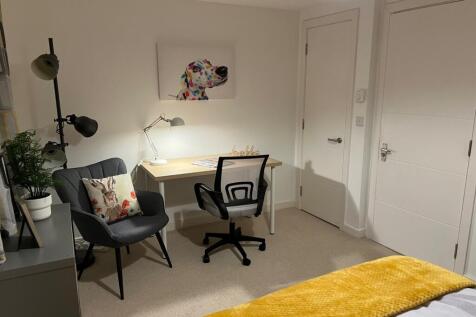 A stylish and inviting double bedroom featuring...