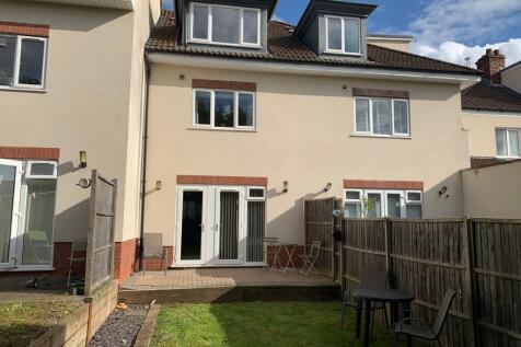 A spacious and well-maintained garden area, per...