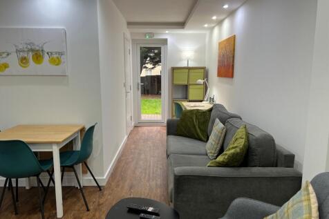 A spacious and stylish modern living room, perf...