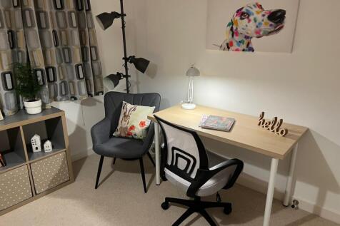 A stylish and inviting study area with modern d...