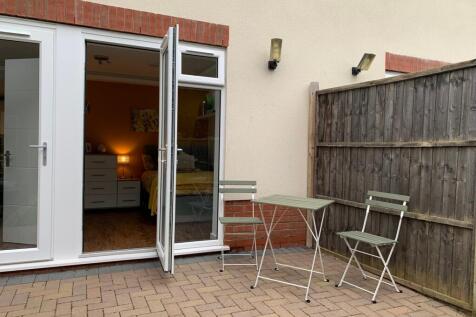 A charming outdoor space with seating, perfect ...