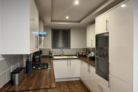 A modern and stylish kitchen with ample storage...