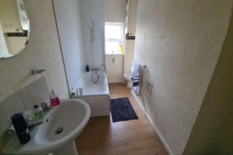 A clean, well-maintained bathroom featuring a b...