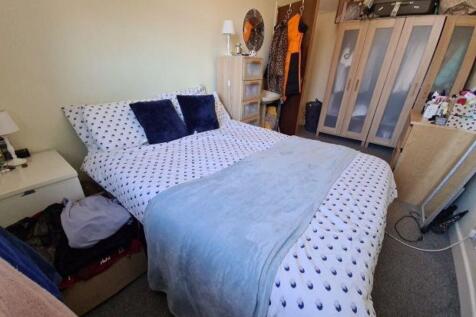 A spacious and well-maintained master bedroom f...