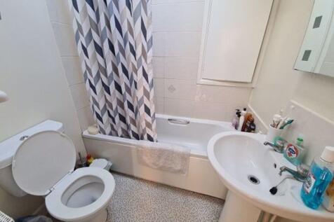 A large, well-maintained bathroom featuring a s...