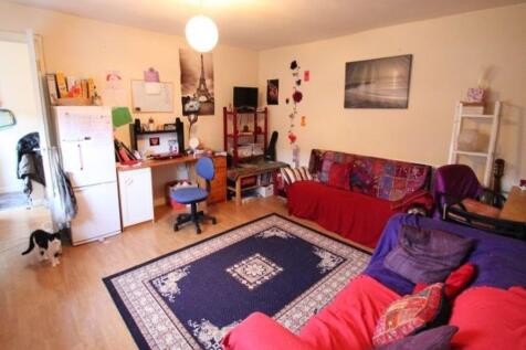 A cozy and well-maintained living room featurin...