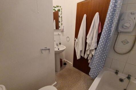 A clean and functional bathroom with essential ...