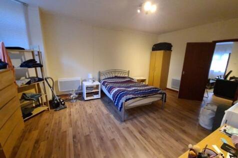 A spacious and well-maintained living room with...