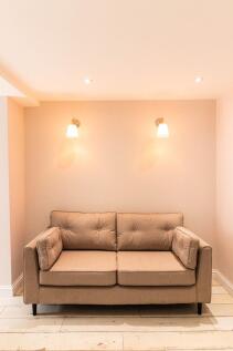 A cozy and well-maintained living room featurin...