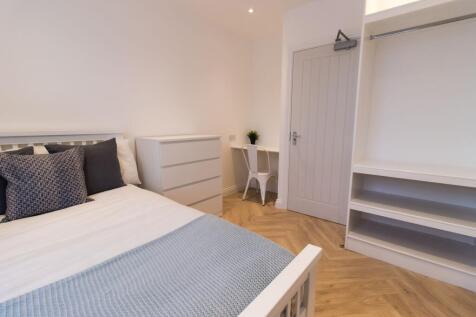 Bright, modern bedroom with a comfortable doubl...