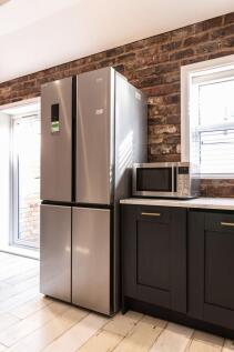 Modern kitchen corner with a stainless-steel fo...