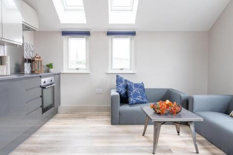 Bright and spacious living room with modern fur...