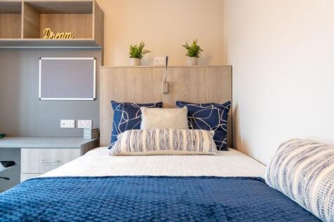 A bright and modern bedroom featuring a double ...