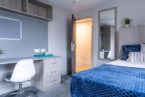 A beautifully designed double bedroom featuring...