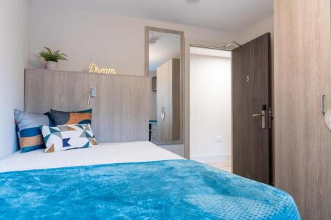 Bright and inviting double bedroom featuring a ...