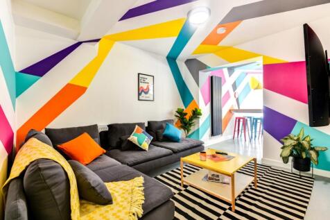 Bright and vibrant living room featuring a cont...