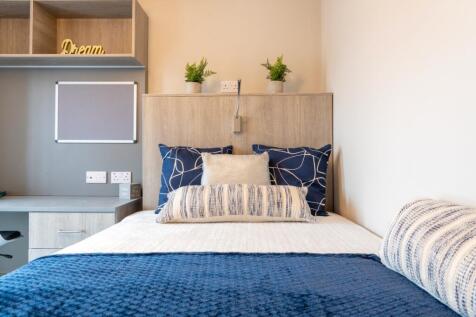 A stylish and inviting double bedroom featuring...