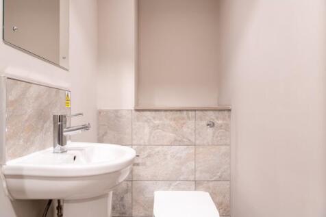 A well-maintained and tidy single toilet, featu...
