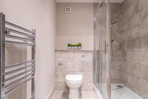 A modern and tidy bathroom featuring a stylish ...