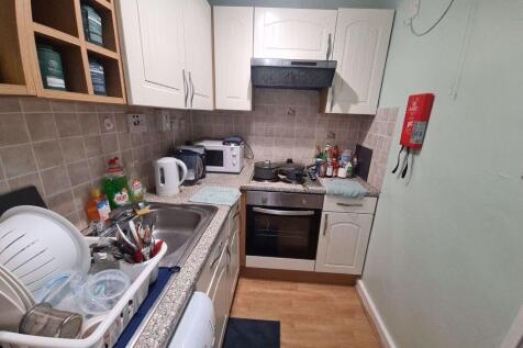 A well-maintained kitchen with ample storage, m...