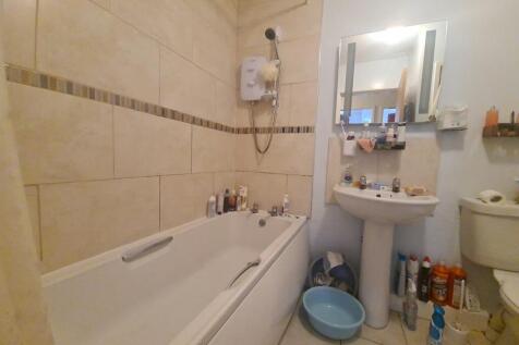 A clean and functional bathroom featuring a lar...