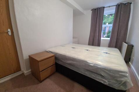 A welcoming bedroom featuring a comfortable dou...