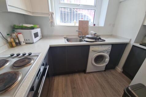 A well-maintained kitchen with ample counter sp...