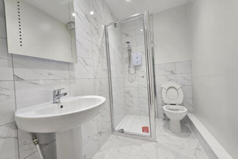 A modern, well-maintained bathroom with a spaci...