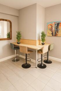 Bright corner workspace with a wraparound woode...