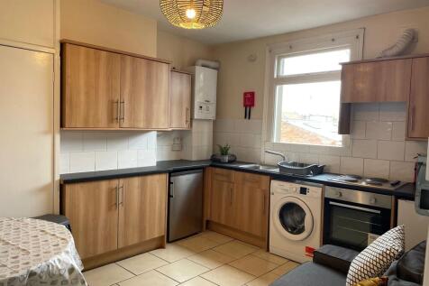 A well-maintained kitchen featuring wooden cabi...