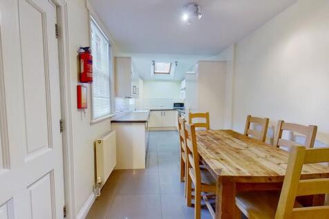 Bright combined kitchen and dining area with a ...