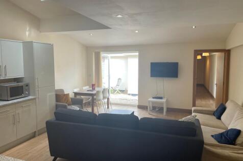 Bright and spacious living area featuring moder...