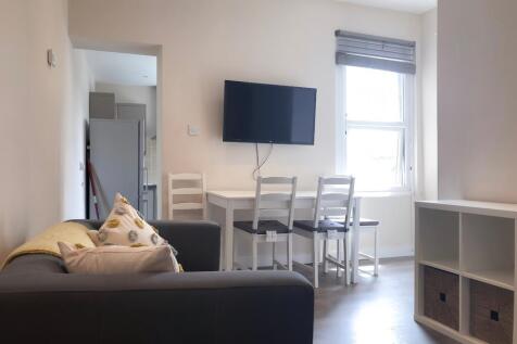 A modern and inviting living room featuring com...