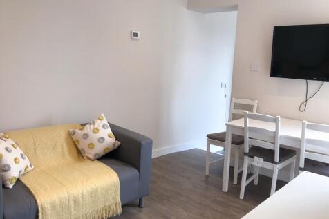 A cozy and inviting living room featuring a com...